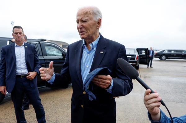 U.S. President Joe Biden speaks to members of the media before boarding Air Force One en route to North and South Carolina, in the wake of Hurricane Helene.