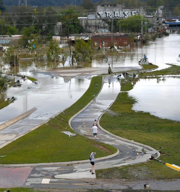 Neighborhoods in Asheville, N.C. were hit hard by floodwaters and mudslides after the worst of Helene Friday morning.