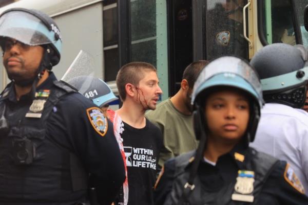 Police restrain pro-Palestinian protesters during Nakba Day demonstration and arrest some demonstrators on May 18, 2024, in Brooklyn, New York.